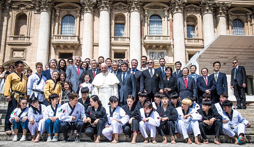WT delegation, demonstration team and Pope Francis in front of St. Peter's Basilica